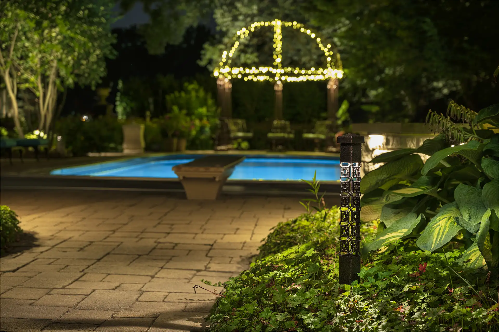 Fisher residence image 2 bollard lights and arbor by pool Lighthouse Outdoor Lighting and Audio Indianapolis IN Indiana