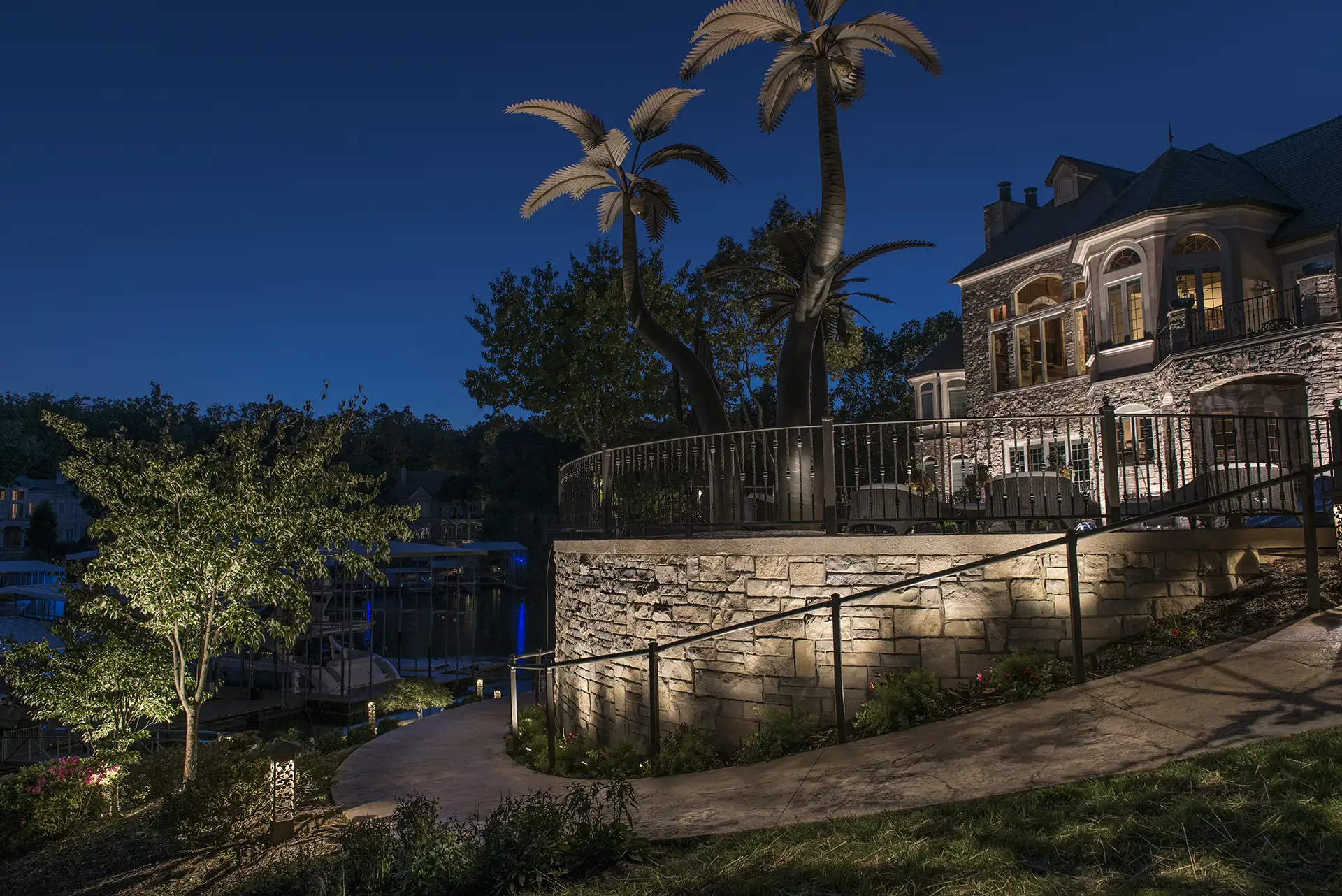 Ozarks lake house image 16 back yard path and palm trees Lighthouse Outdoor Lighting and Audio Central MO Missouri