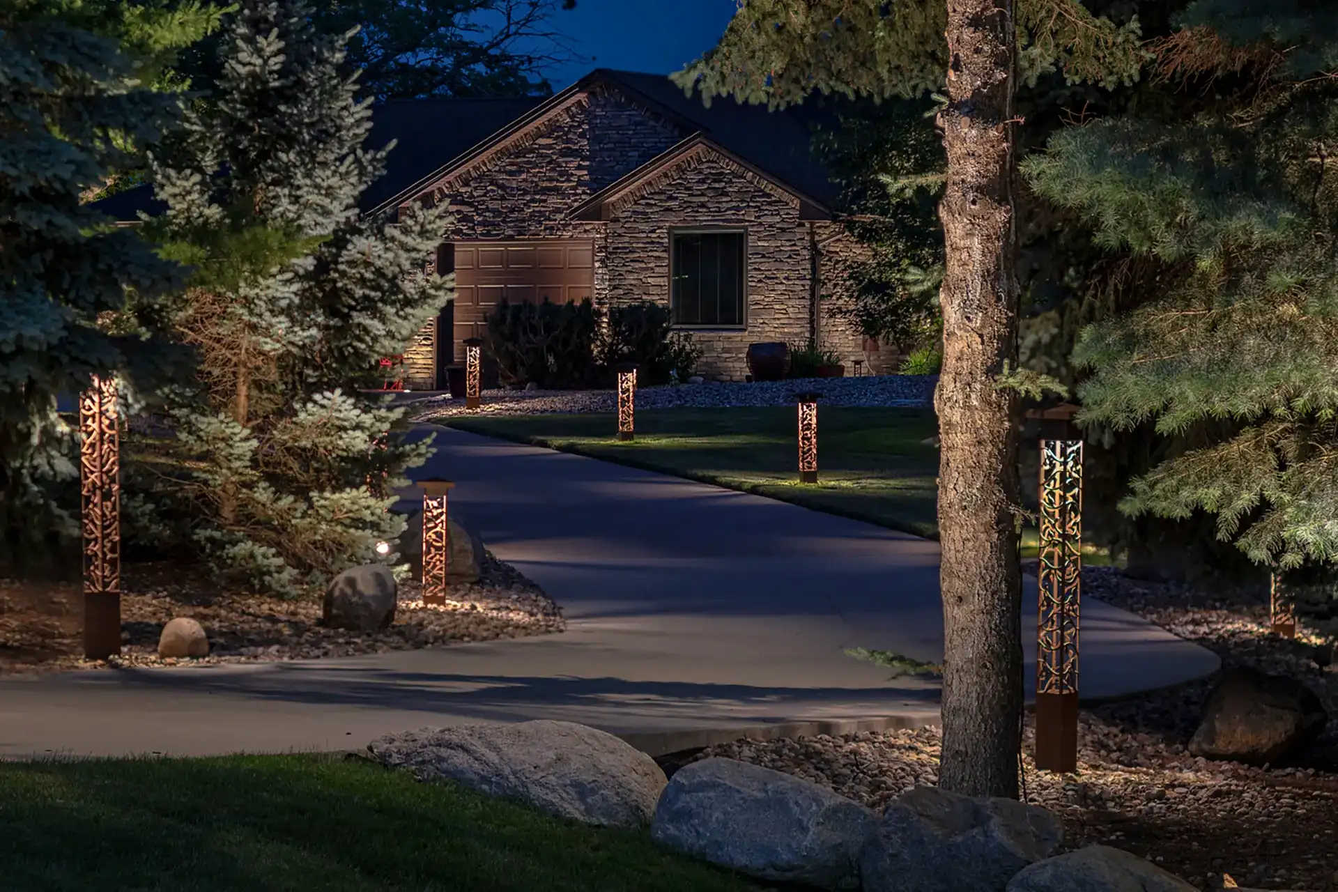 Ryan residence image 1 front view driveway night Lighthouse Outdoor Lighting and Audio Des Moines IA