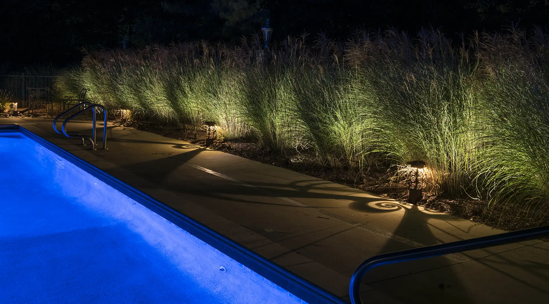 Schneider residence image 5 pool seating area bollard lights Lighthouse Outdoor Lighting and Audio central Missouri