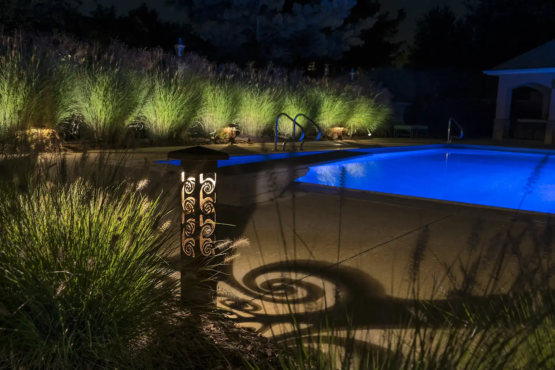 Schneider residence image 10 pool seating area bollard light Lighthouse Outdoor Lighting and Audio central Missouri