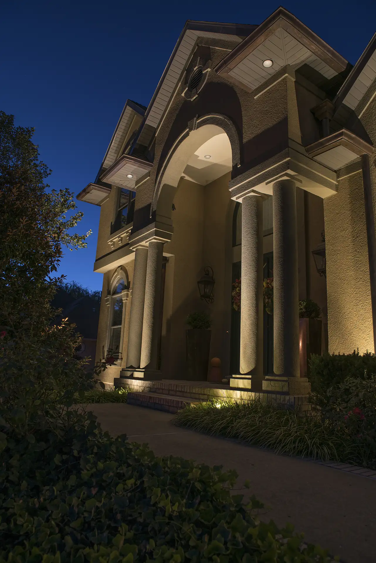 Suburb Stucco image 4 front entry columns Lighthouse Outdoor Lighting and Audio central Missouri