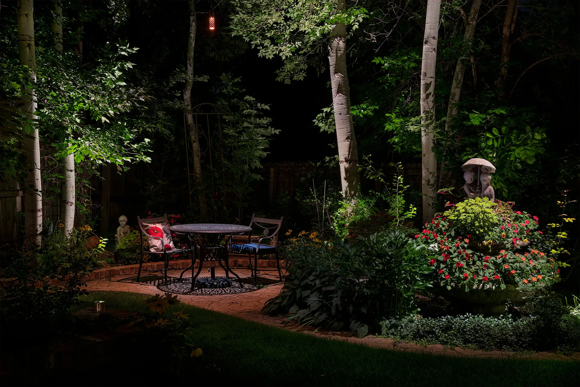 Windsong Ct image 7 garden seating area art statuary Lighthouse Outdoor Lighting and Audio Denver CO